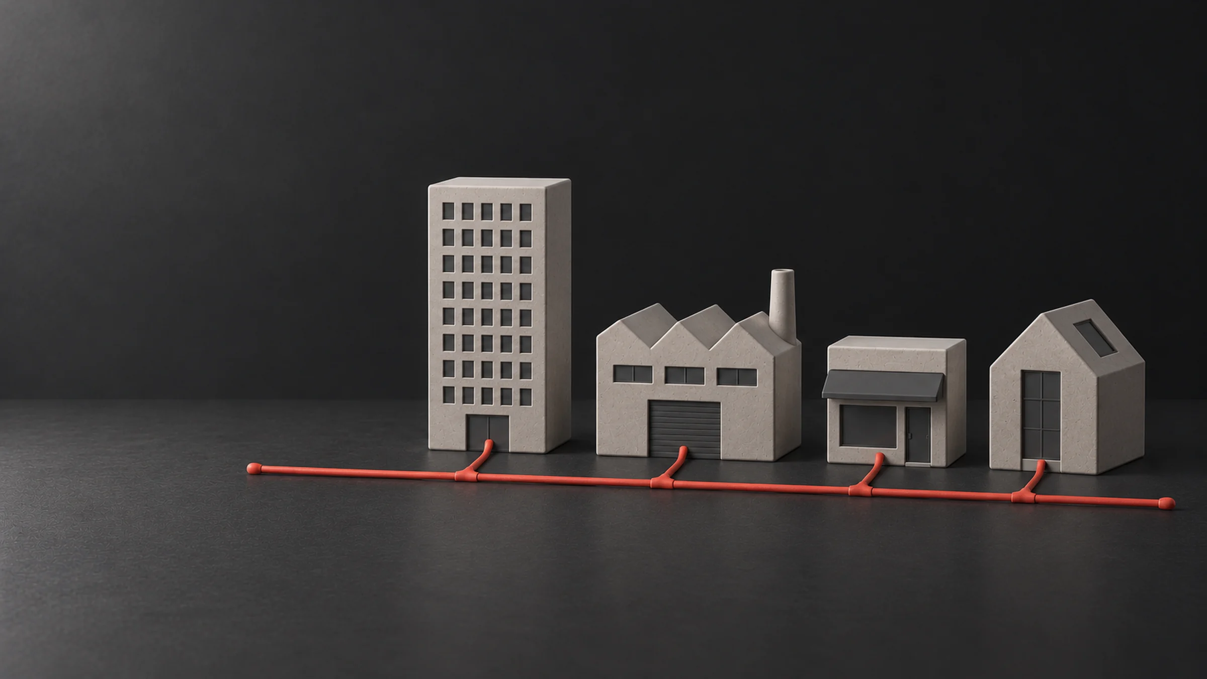 An office building, a factory, a shop and a house joined by the same red line